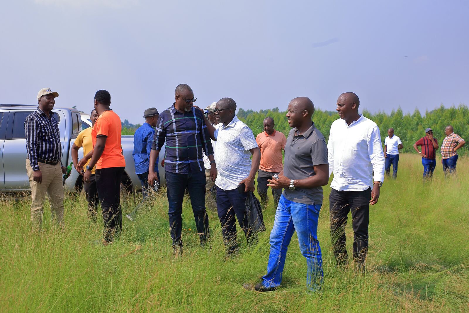 Prospective buyers and Ruhaama staff walking an estate on a site visit